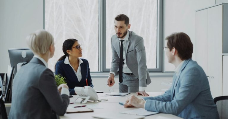 Business professionals in a meeting around a table